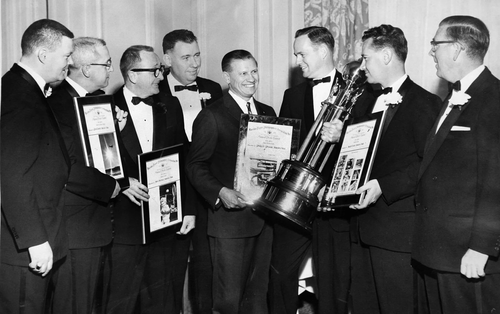 PRIZE-WINNING PHOTOGRAPHERS-Boston Globe photographers, all of whom took prize-winning shots during 1960, pose with Gov. John A. Volpe at last night's Boston Press Photographers Ball at the Sheraton Plaza. From left are Jack O'Connell, Paul Connell, 