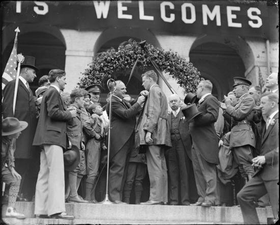 Lindy being decorated by Gov. Fuller.jpg