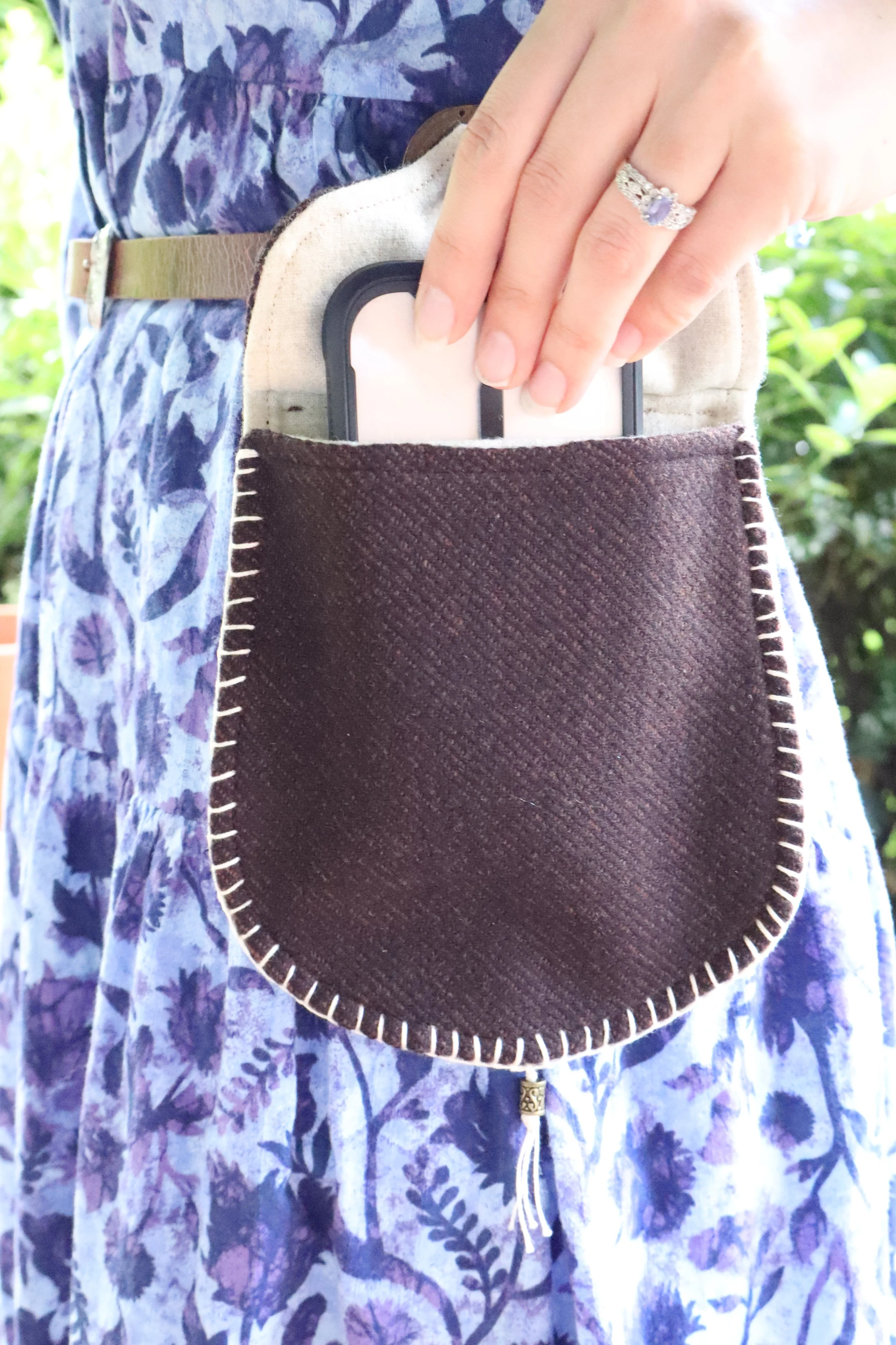 Brown Wool Bag with a cell phone being pulled out of it