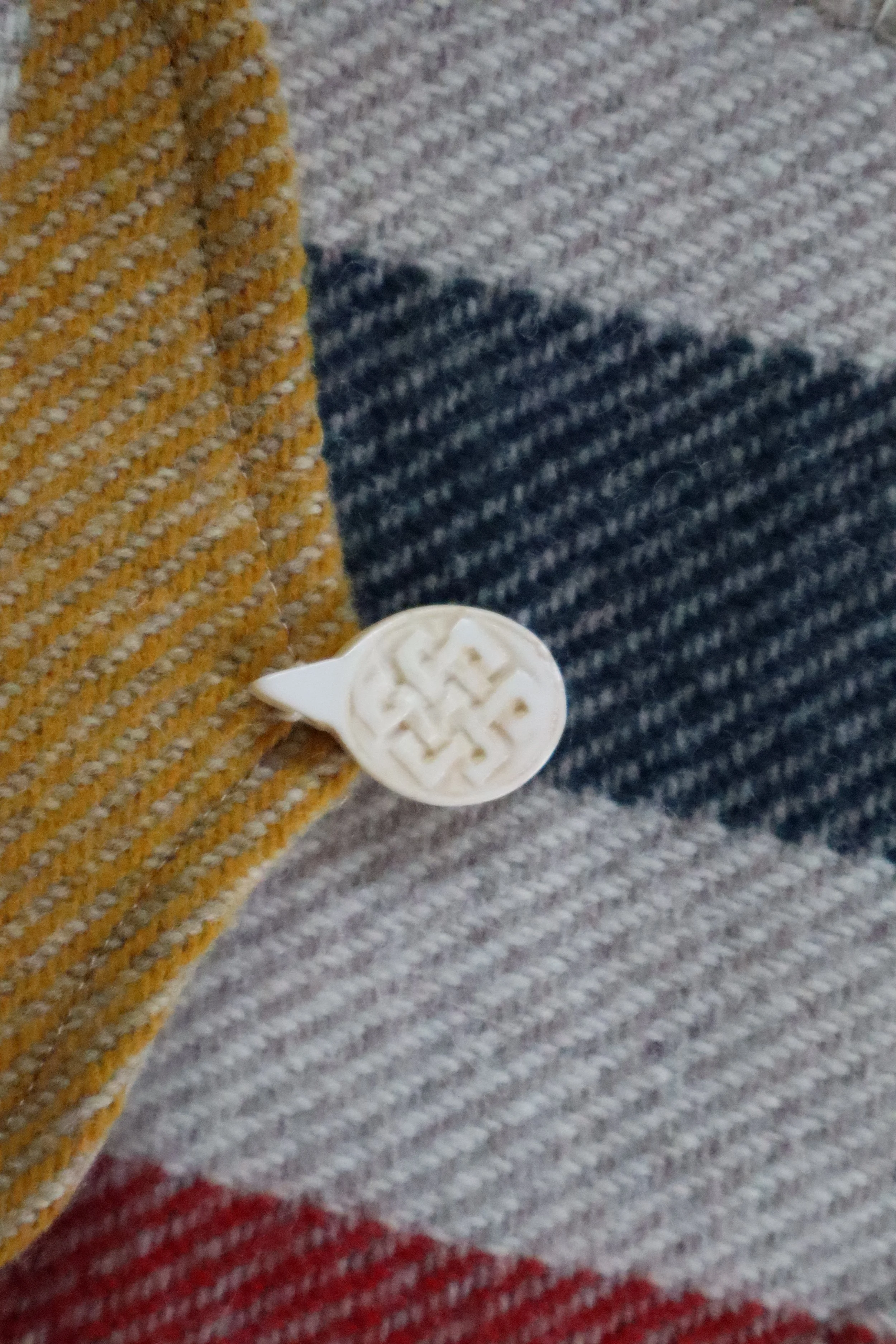 Closeup of Tan and multicolor Wool Bag with bone clasp