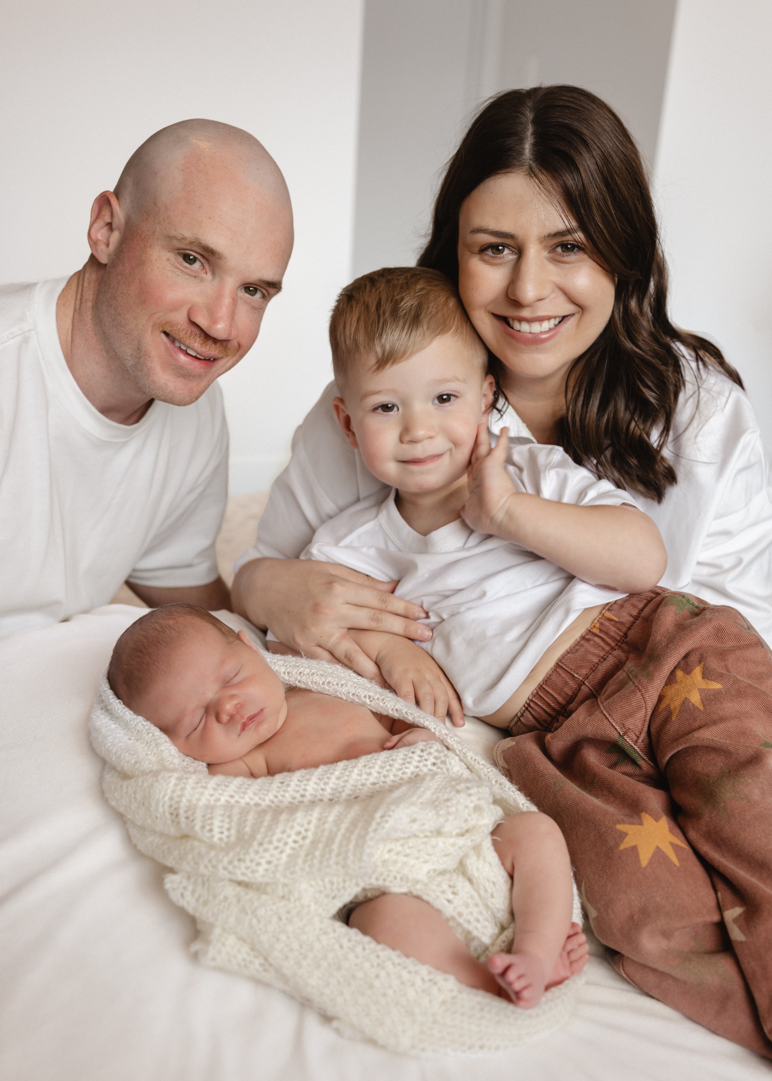 newborn photo with family and older brother