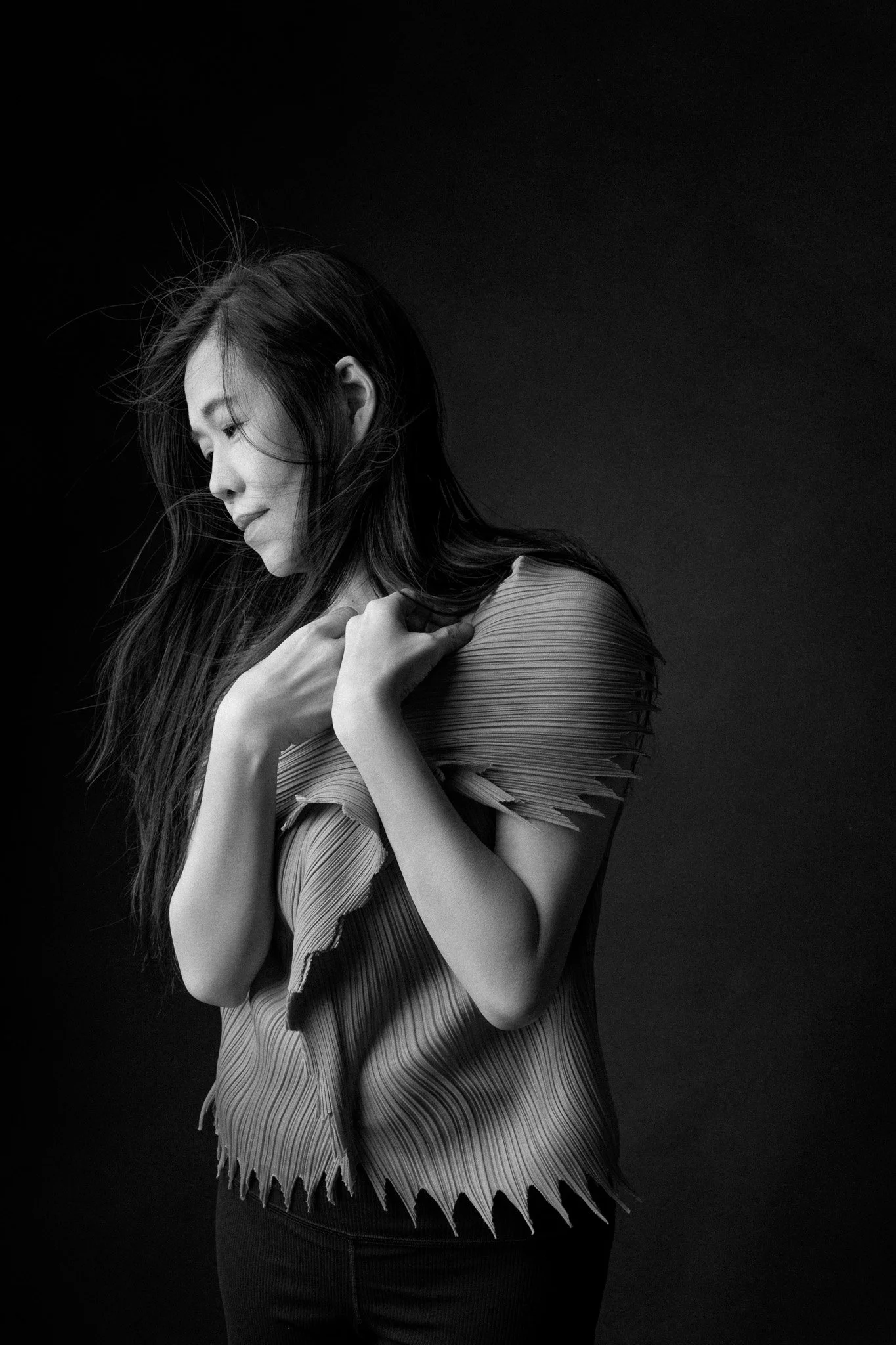 Expressive black and white portrait of Dr Beverly Low Yuen Wei, veteran performing arts practitioner and lecturer