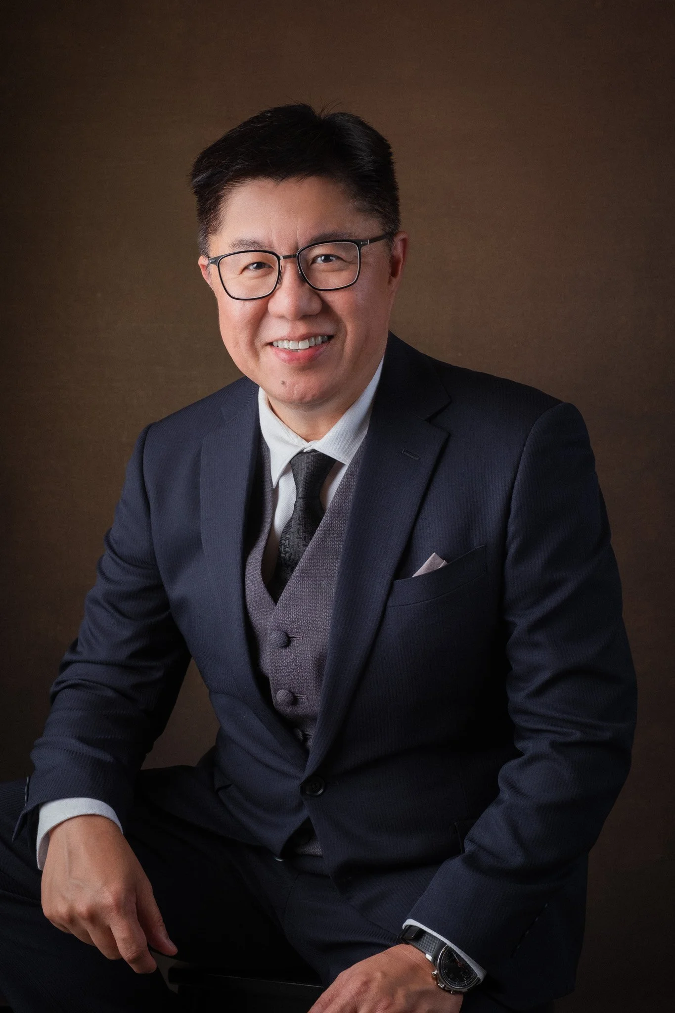 Corporate headshot for John Lim, part of board of committee for Assumption English School, Singapore.