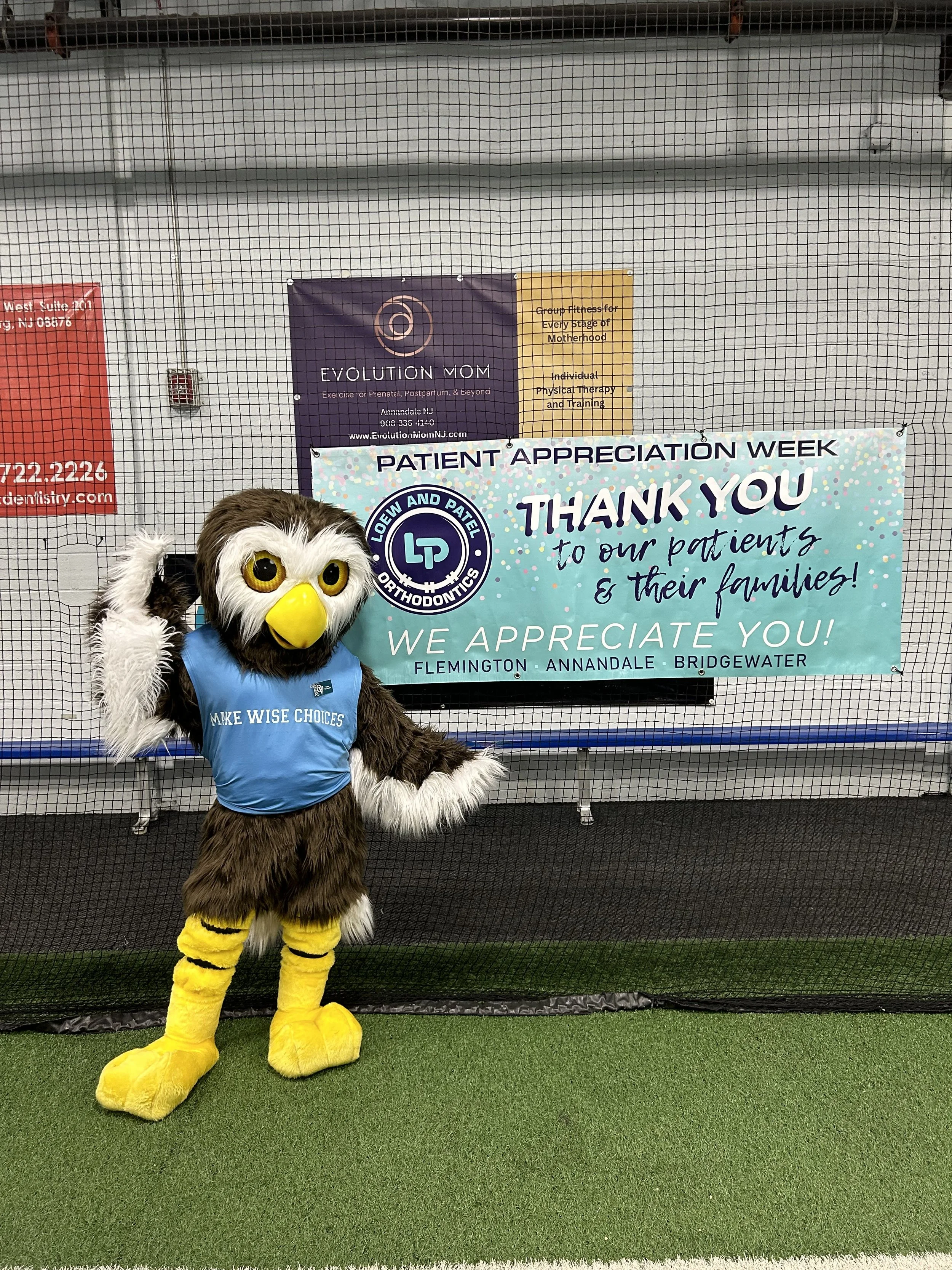 Owlbert with Loew and Patel sign.jpg