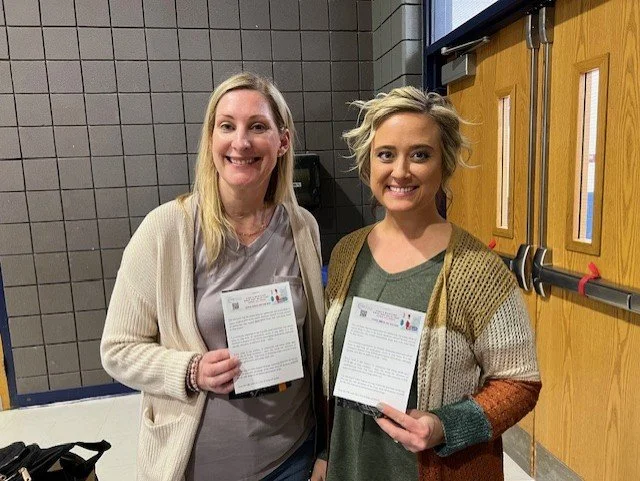 Ladies holding cards.jpg