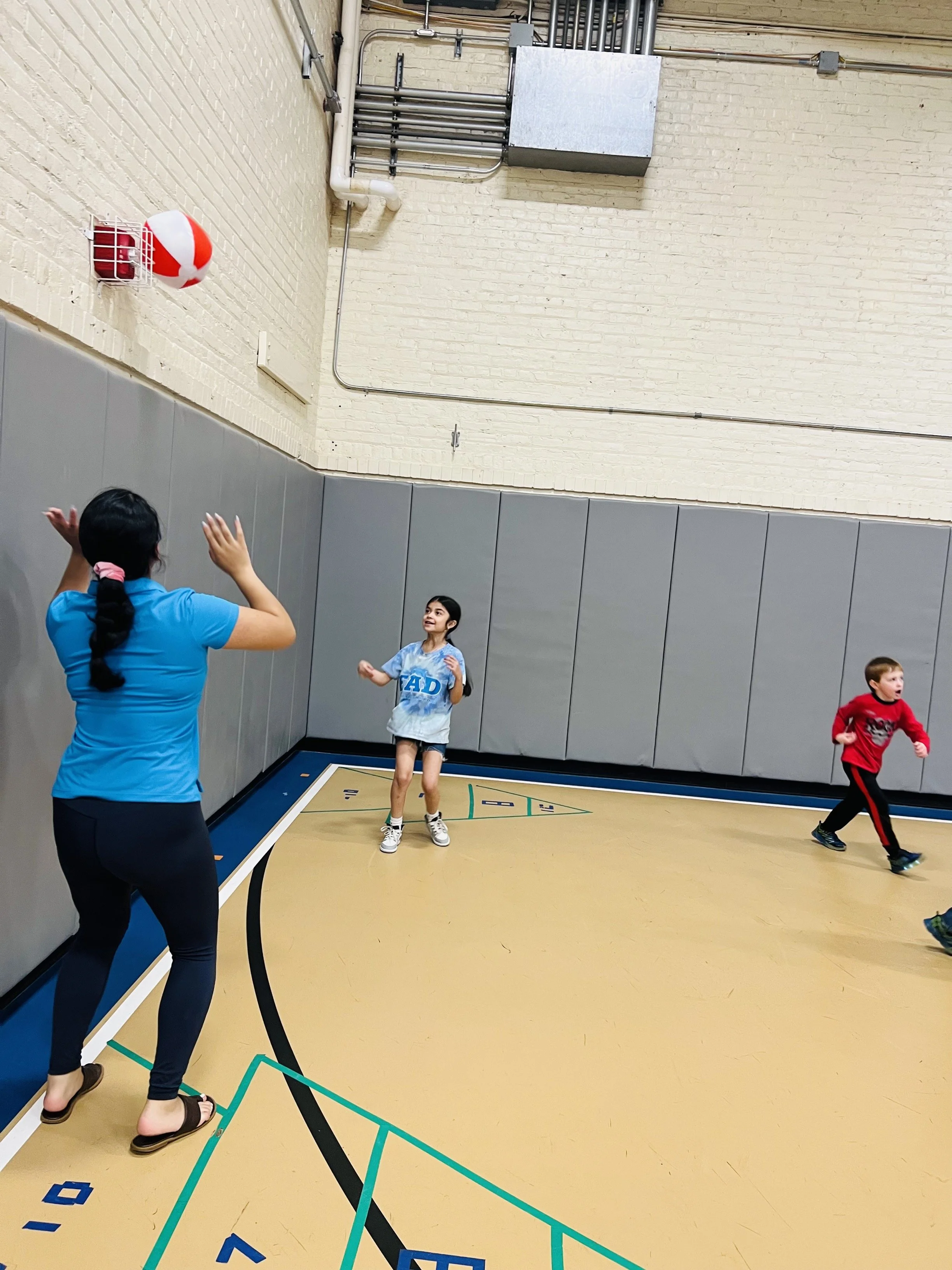 Amy Playing VB with kid.jpg