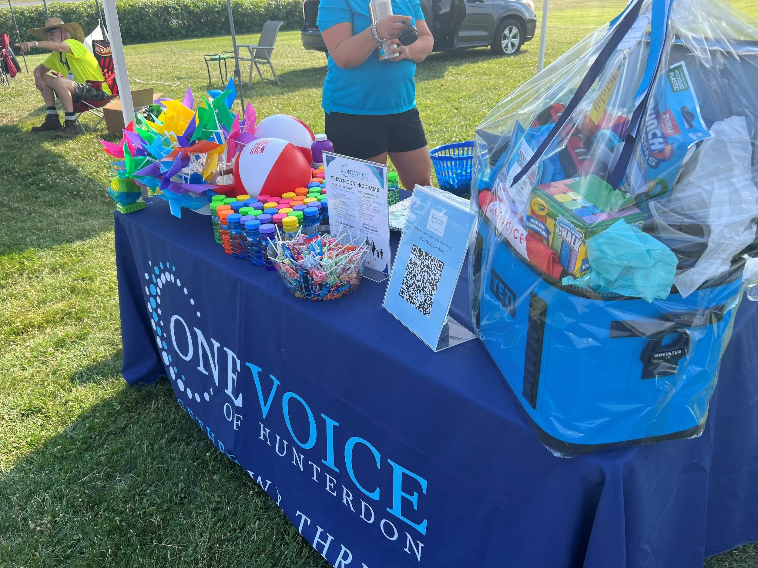Table with pinwheels, bubbles, candy, yeti.jpg