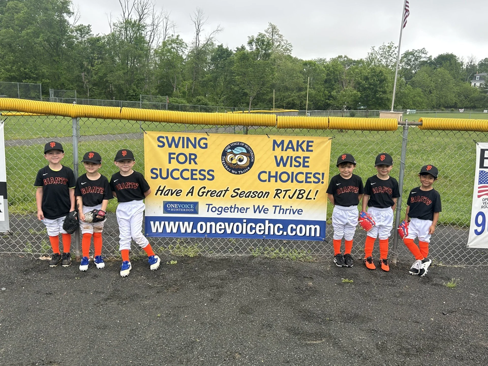 Team in front of sign.jpg