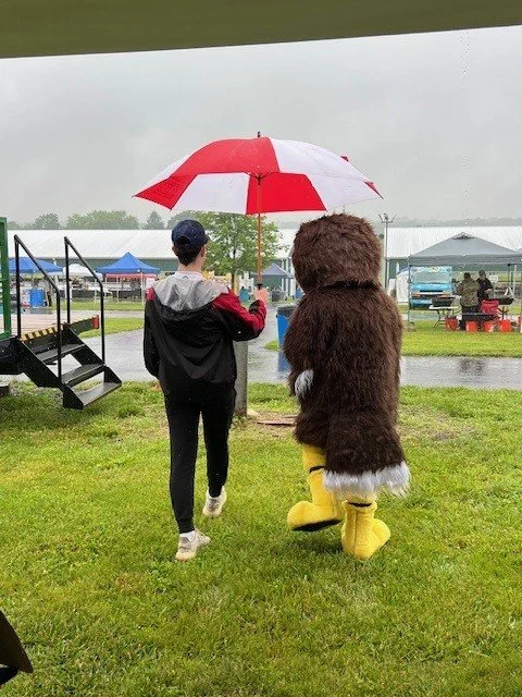 Owlbert and Adam with umbrella walking.jpg