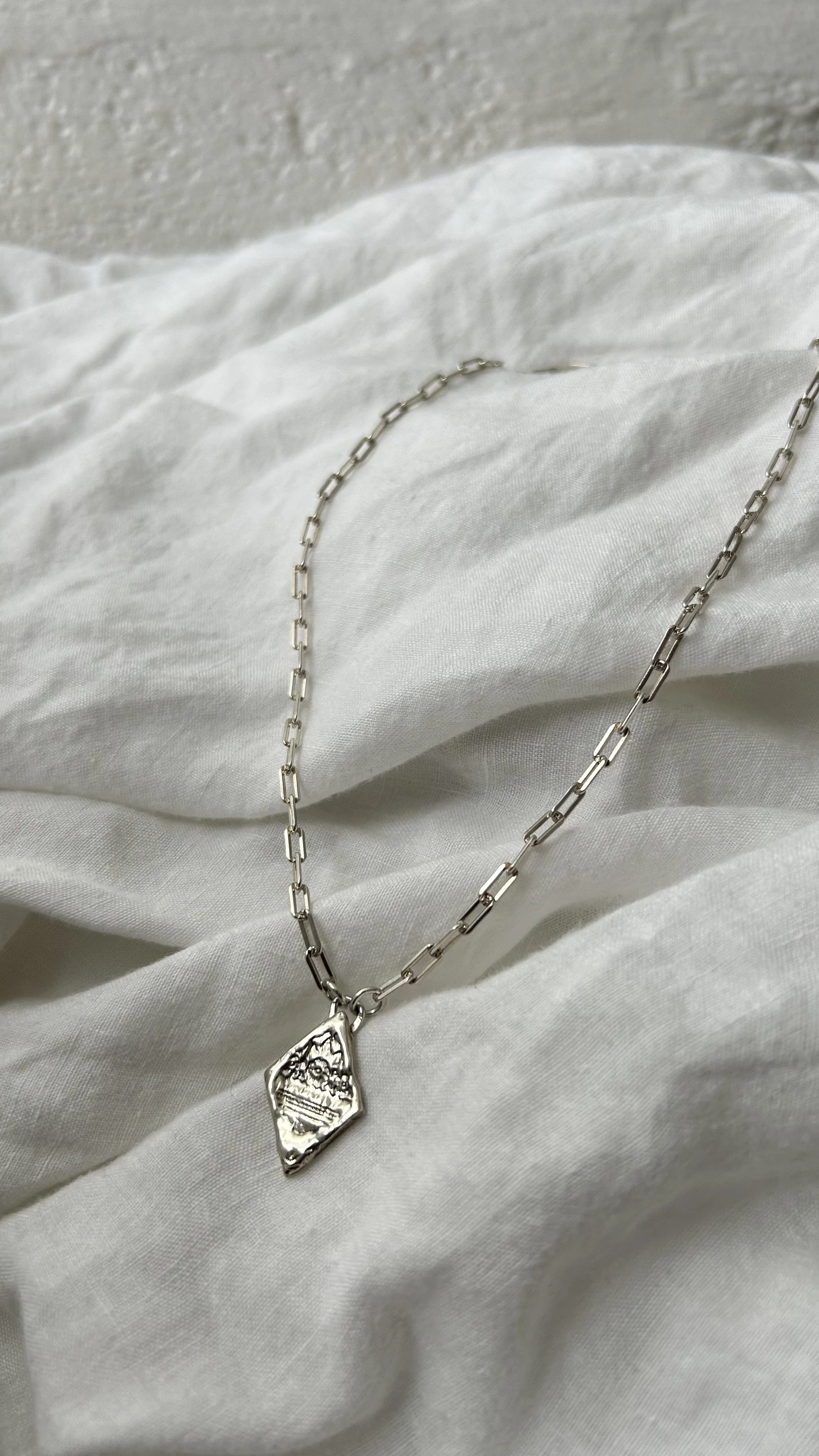 Diamond pendant on paperclip chain