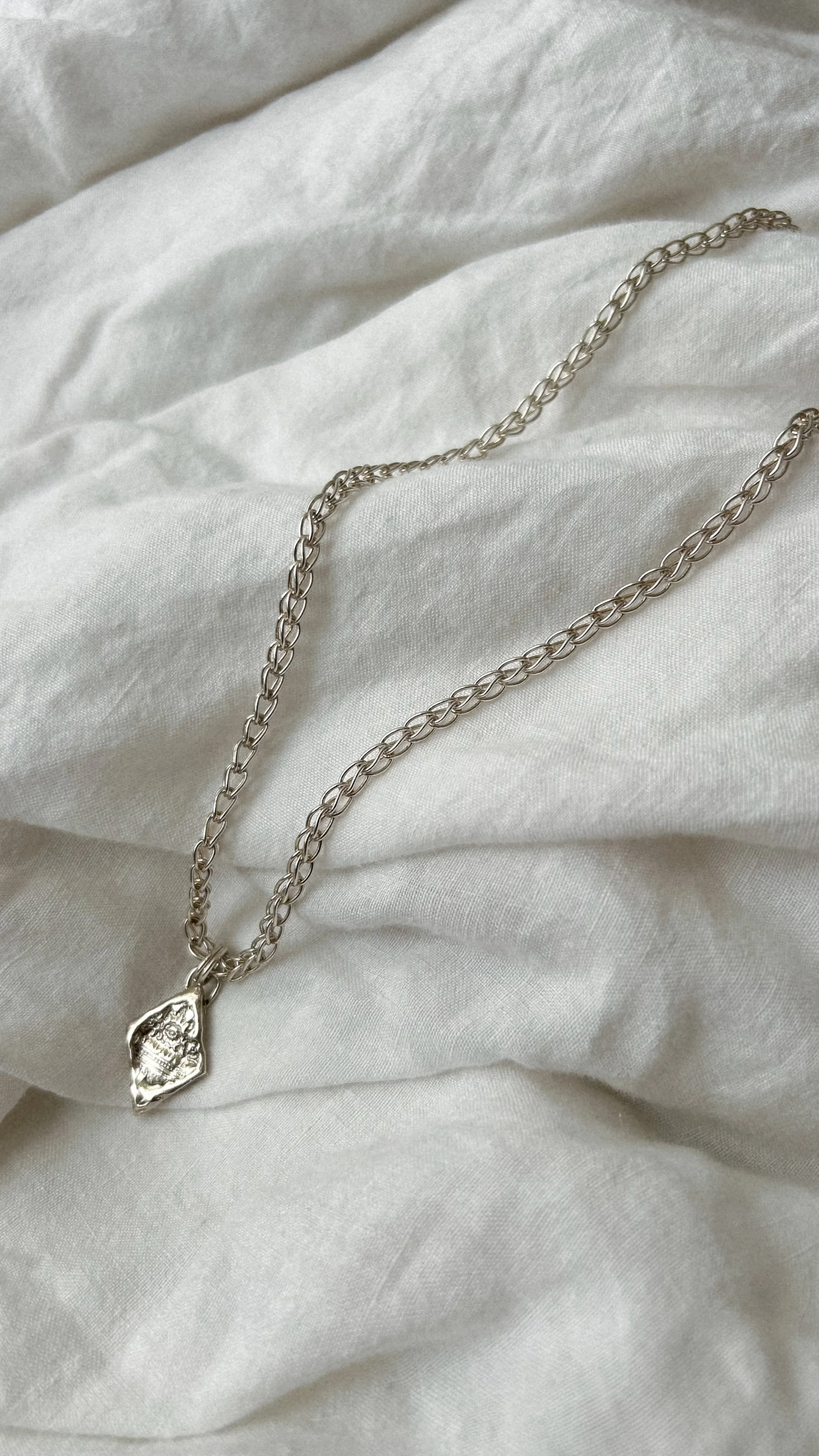 Diamond pendant on Ancient chain
