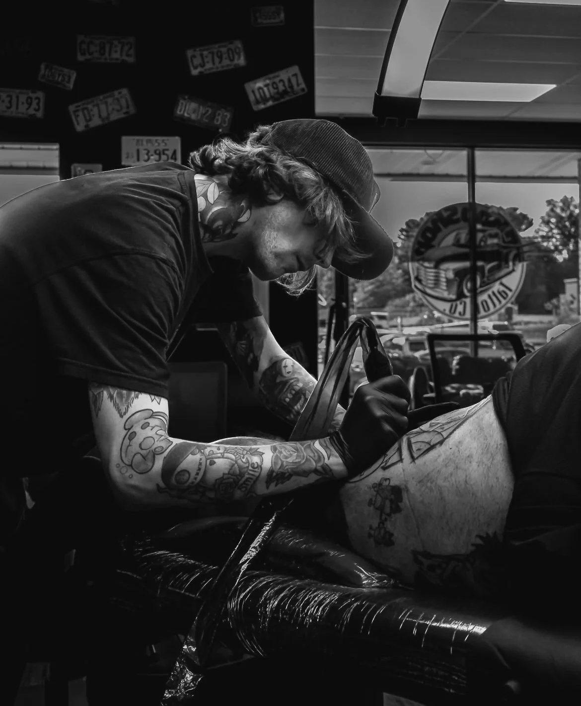 A black and white headshot of artist Christian Magnaterra.