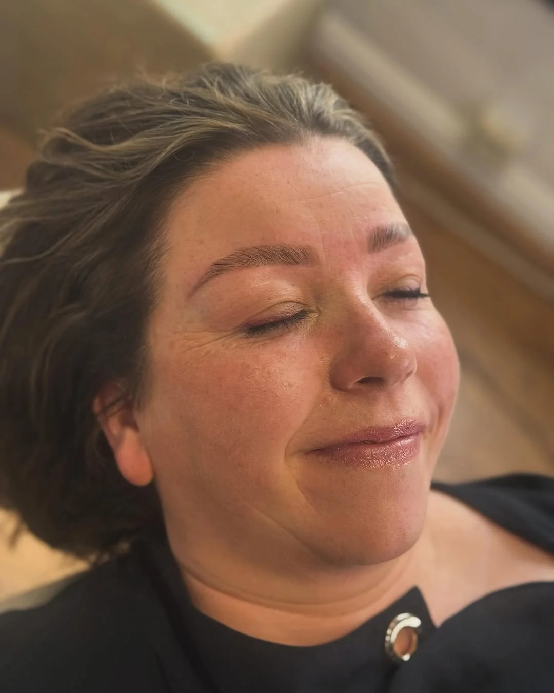 Client relaxing during a rejuvenating facial
