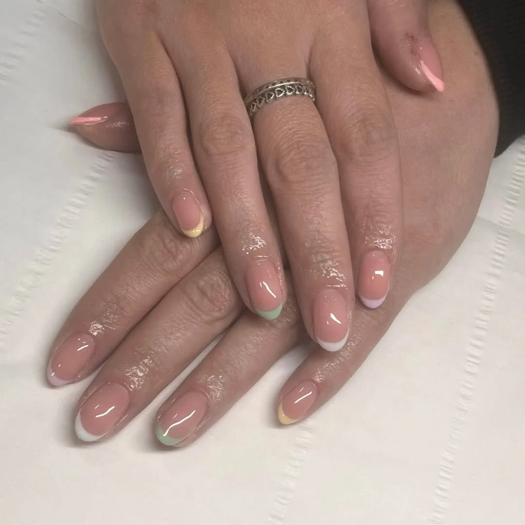 Display of colourful nail polishes and manicure tools