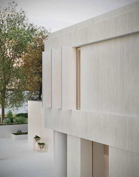 Exterior facade clad in Travertino Bianco porcelain, matte light stone-look finish