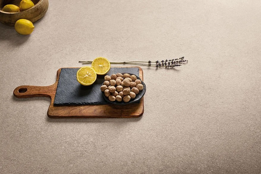 Provençale porcelain benchtop scene with timber board, matte cocciopesto-look surface in warm tones