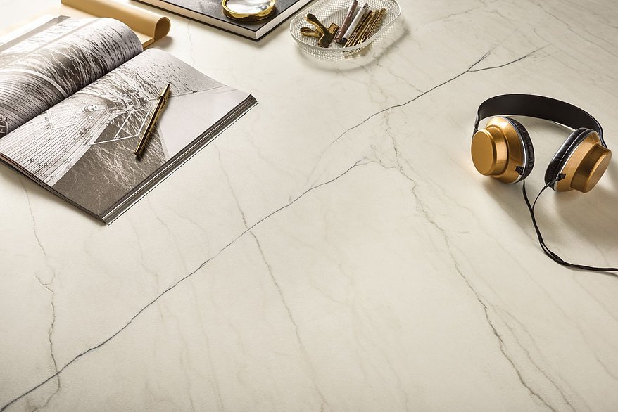 White Macaubas porcelain surface detail with accessories, satin ivory quartzite-look finish