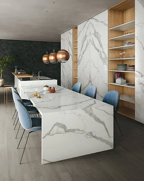Dining space with Classic Statuario porcelain tabletop and feature wall cladding, white marble-look finish with timeless grey veining