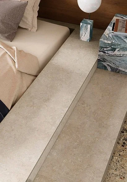 Palladium Ivory porcelain benchtop and floor detail, limestone-look surface in warm ivory tones