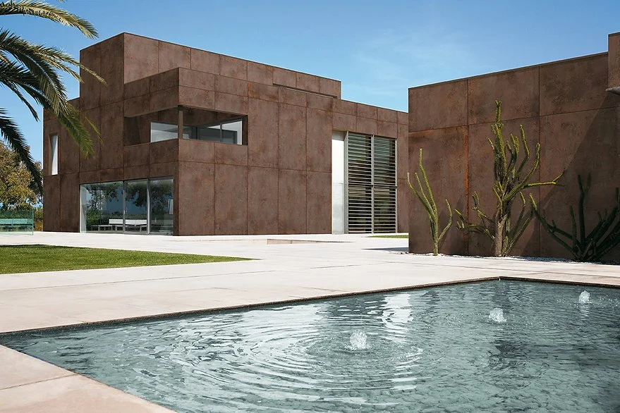Exterior facade clad in Metal Corten porcelain, matte corten steel-look finish