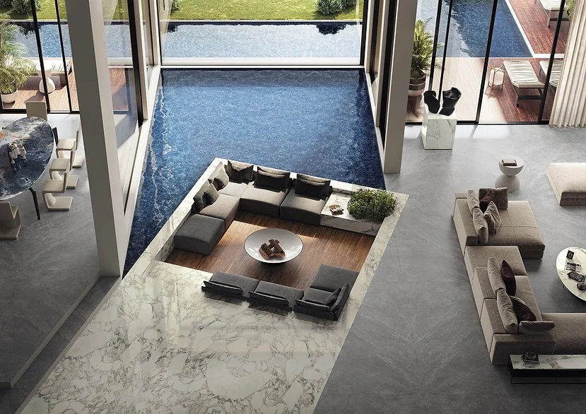 Living space with Calacatta Magnifico Through Vein porcelain flooring, satin marble-look surface with bold veining