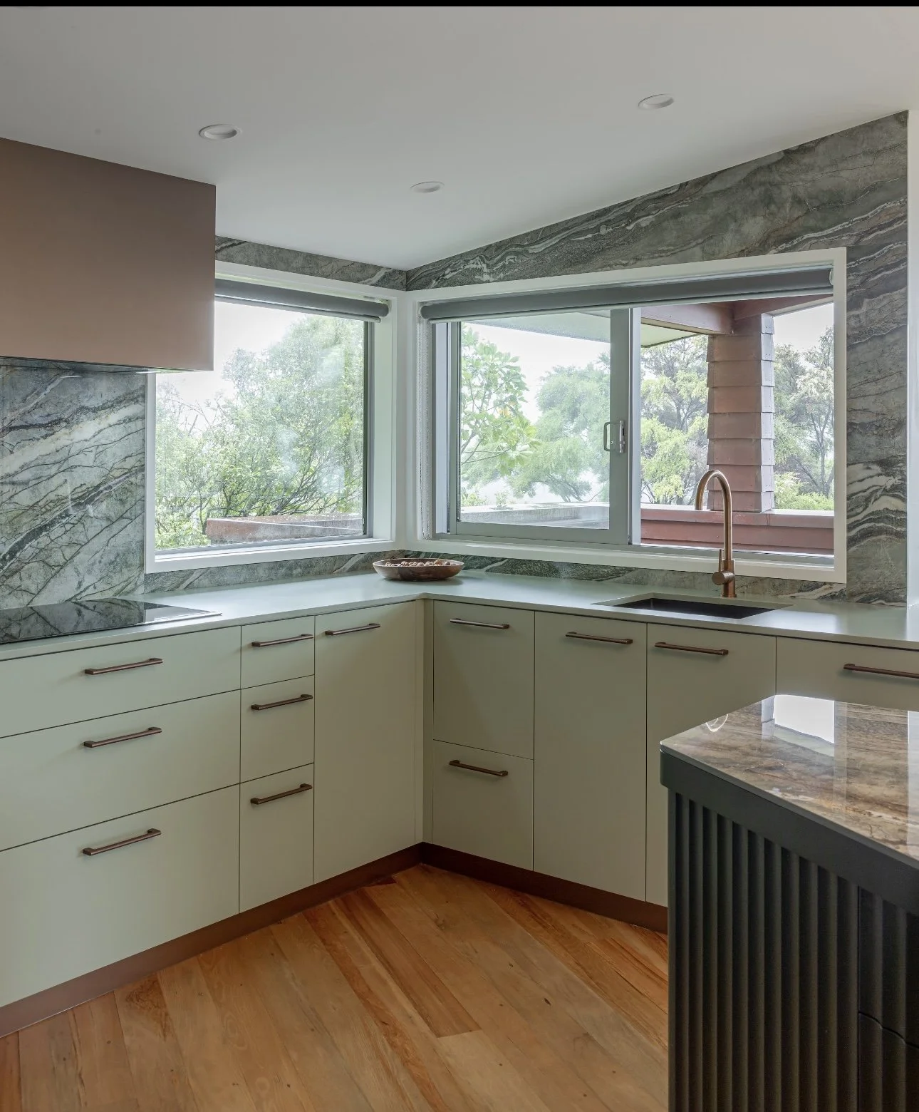 Kitchen island benchtop in Royal Peacock porcelain, polished marble-look surface
