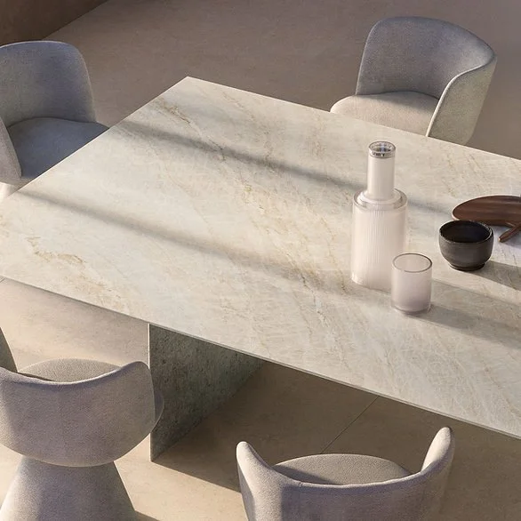 Dining table in Taj Mahal porcelain, satin marble-look surface with champagne tones and gold veining