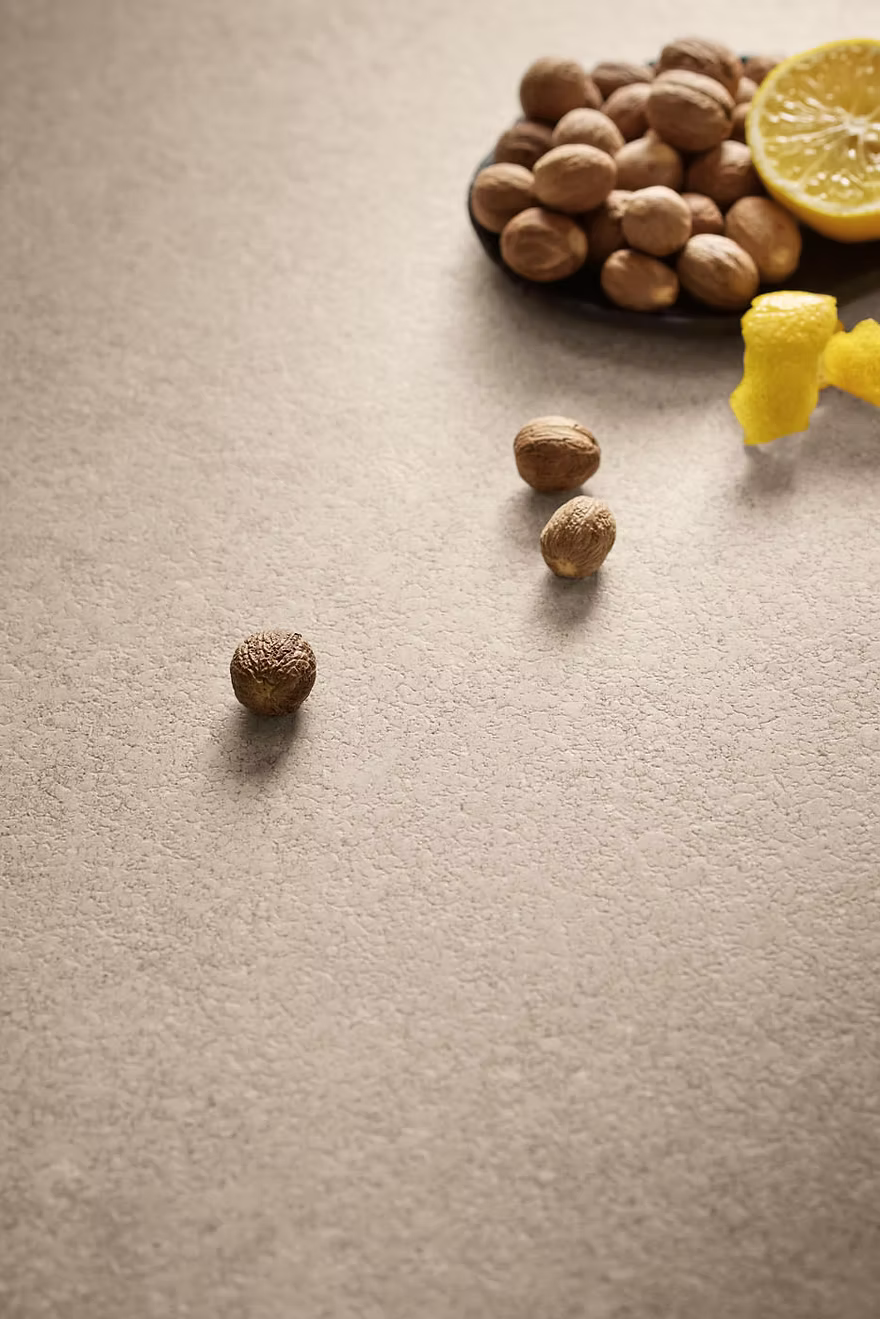 Close-up of Provençale porcelain surface, matte cocciopesto-look texture with earthy tones
