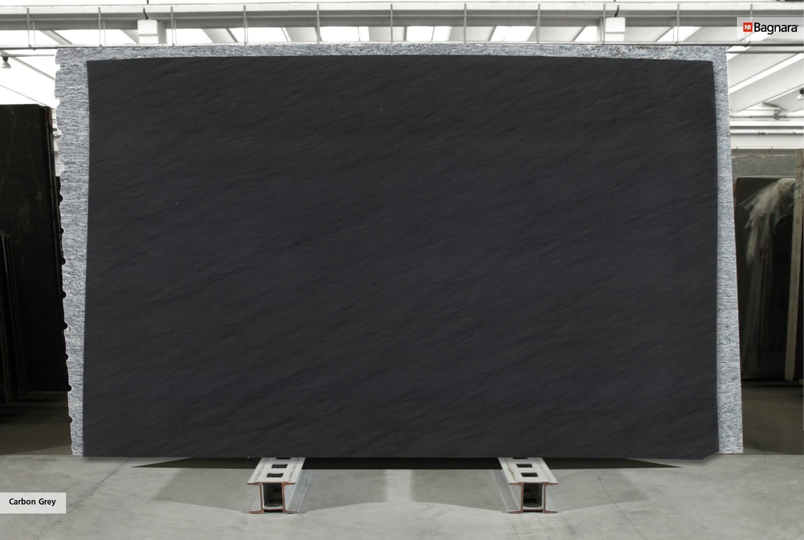 Bagnara Quartzite Carbon Grey quartzite slab in warehouse, honed finish