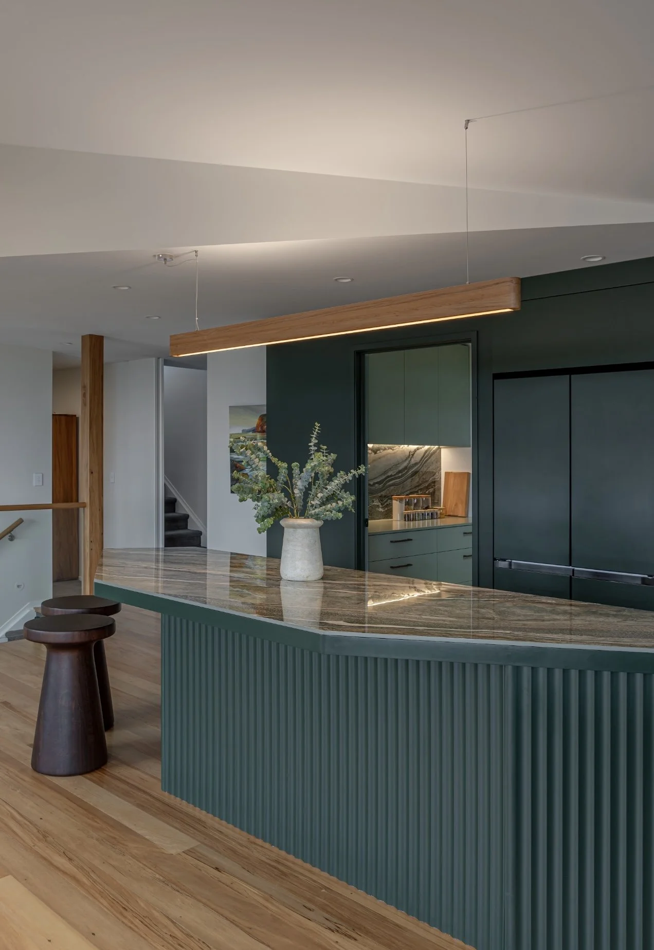 Kitchen island benchtop in Royal Peacock porcelain, polished marble-look surface