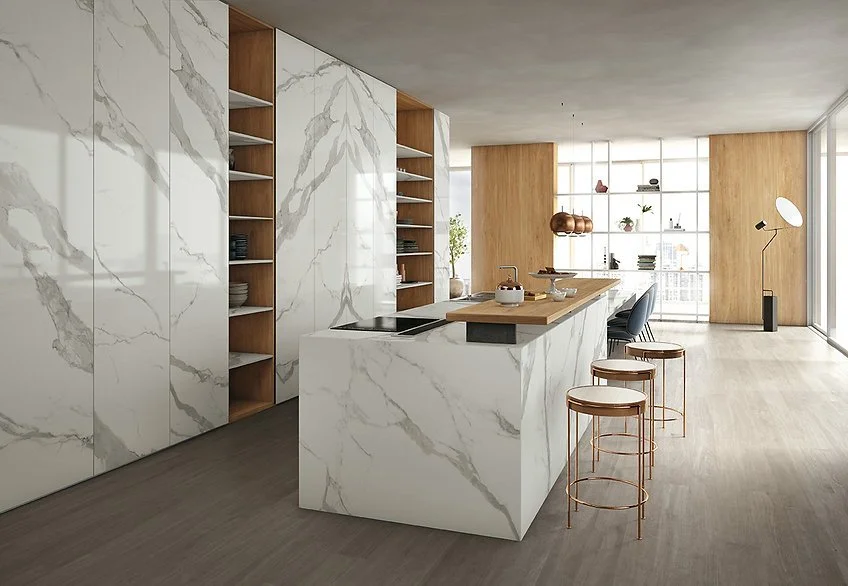 Open-plan kitchen with Classic Statuario porcelain benchtop and waterfall island, white marble-look surface with soft grey veining
