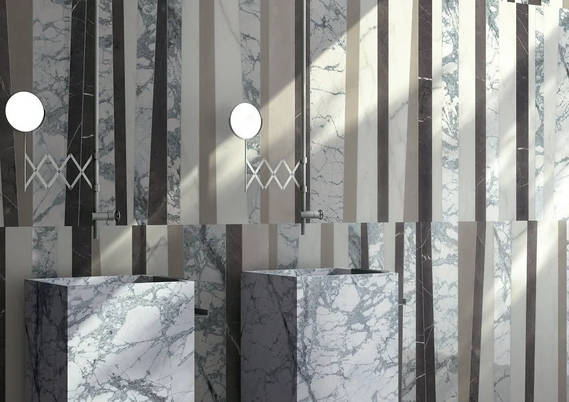 Pietra Grey porcelain used as a dark grey backdrop behind marble-look divider panels