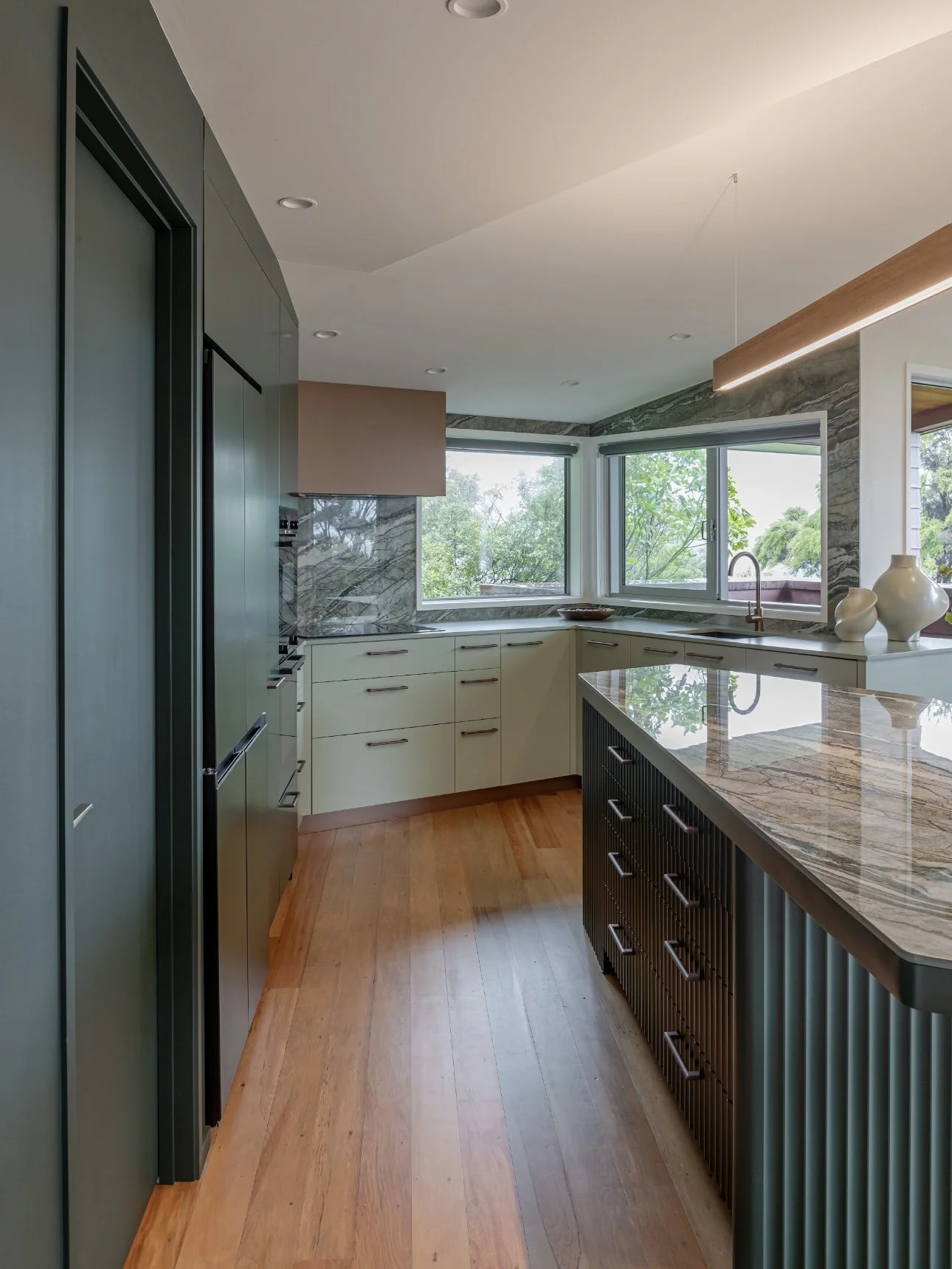 Kitchen island benchtop in Royal Peacock porcelain, polished marble-look surface