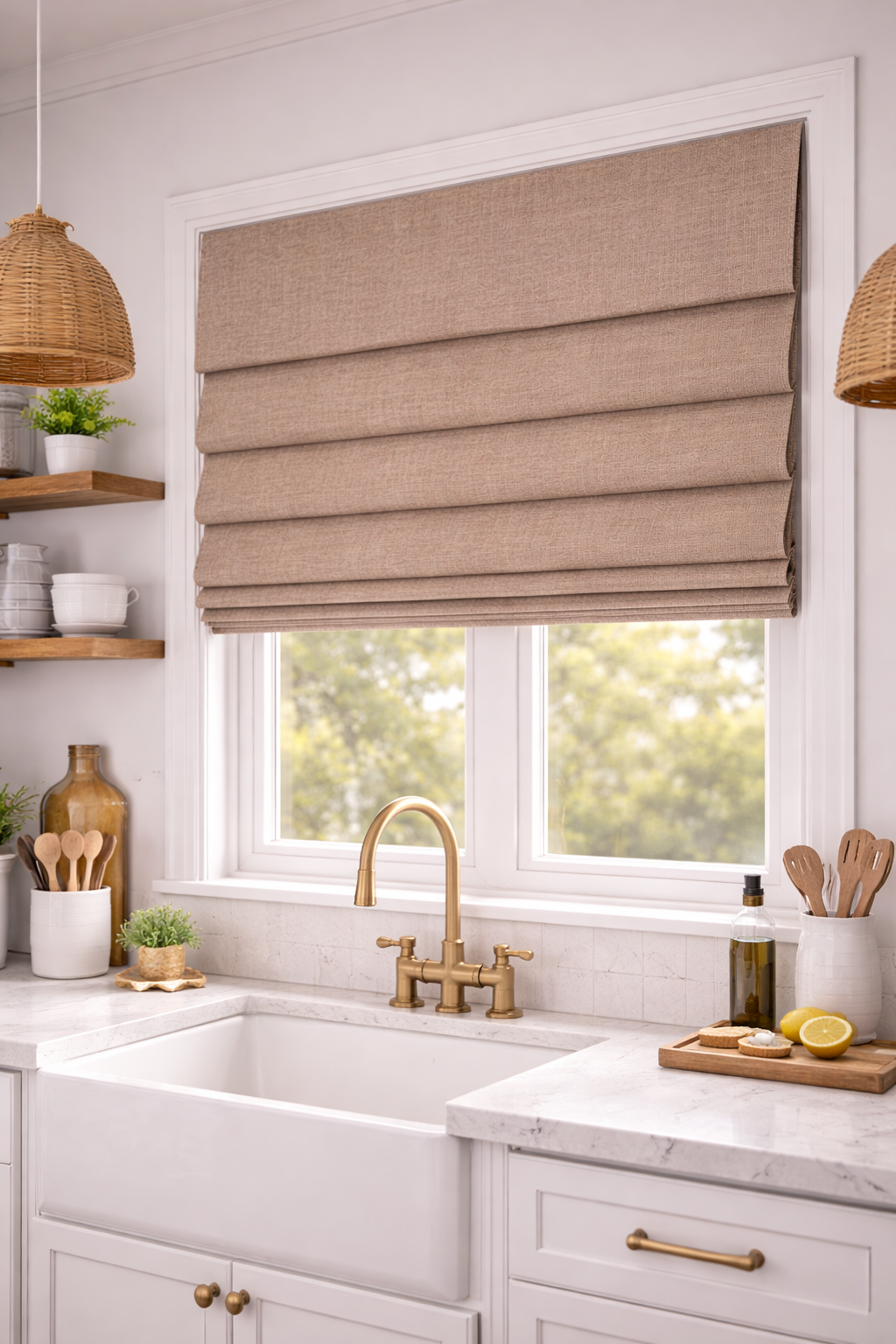 Kitchen window with beige Roman shade, white cabinetry, brass faucet, marble countertop, and shelves with dishes and plants.