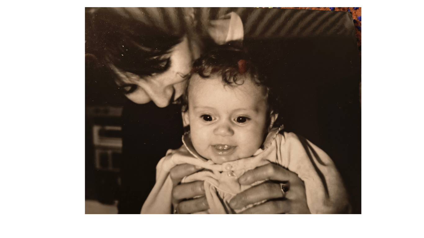 Colette and her baby daughter, black and white picture, mum holding and looking down at baby both facing camera, postnatal care in South London