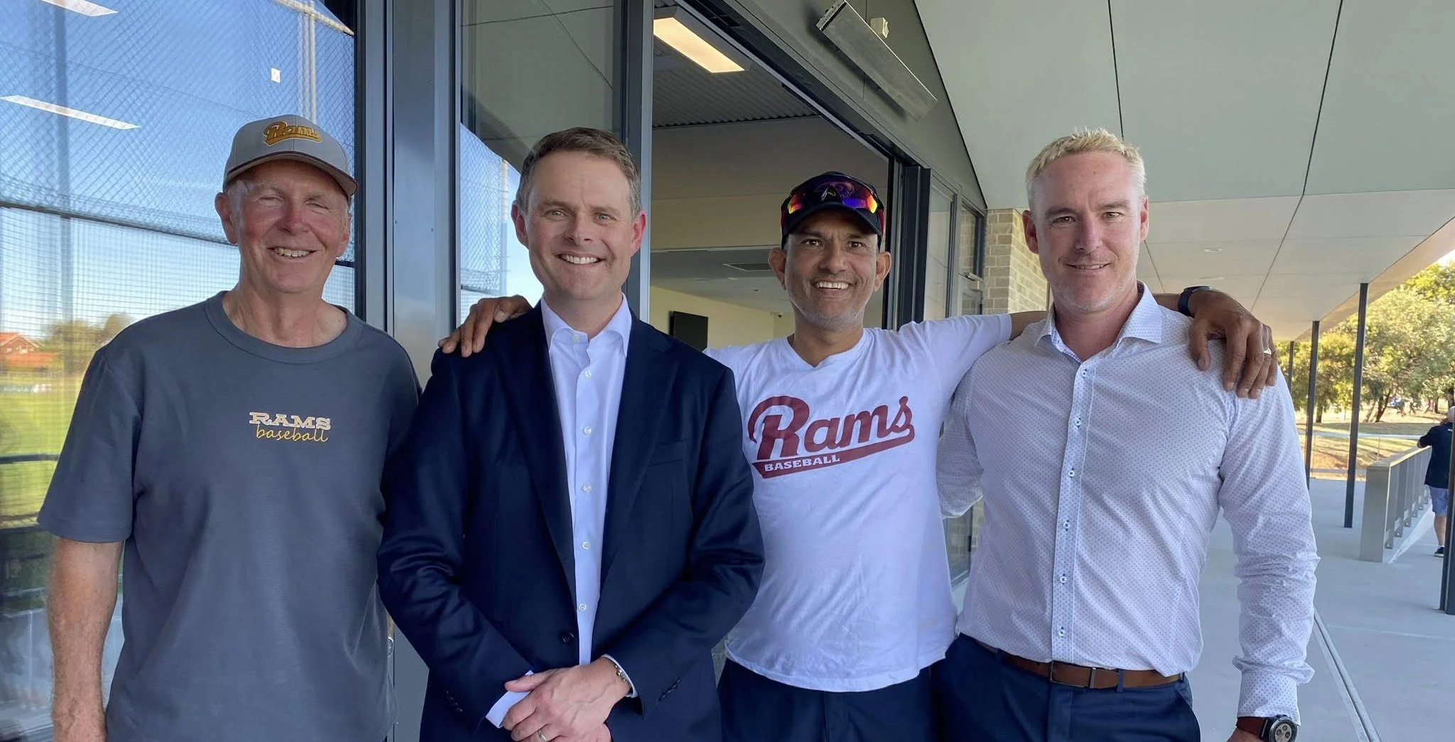 Maroon-colored poster with white text that reads 'Annual General Meeting' and a circular logo with the words 'West Lakes Sports Club' surrounding a stylized 'W'.