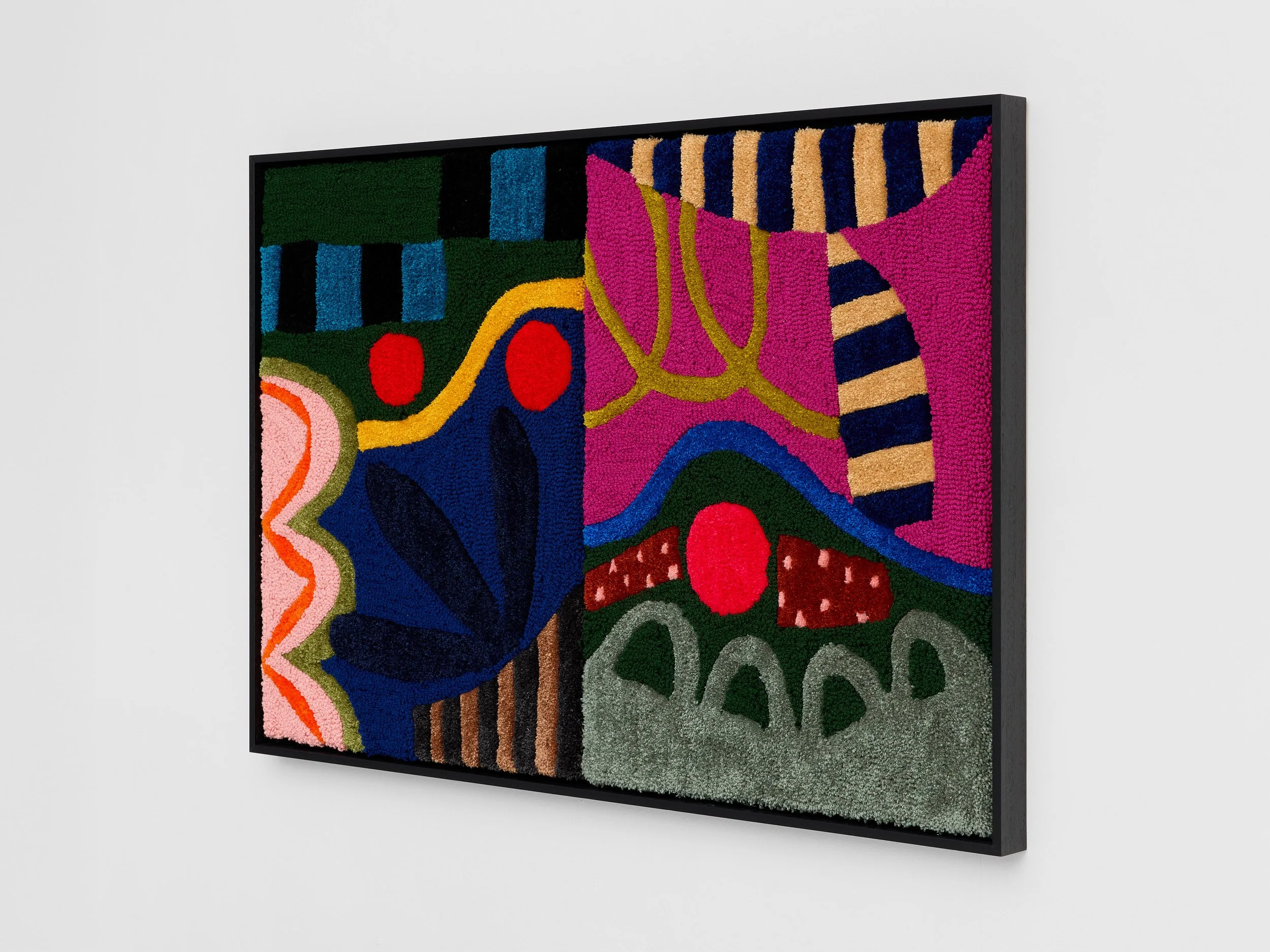 Colorful abstract textured artwork with bold shapes and patterns in bright colors, framed and hanging on a white gallery wall.