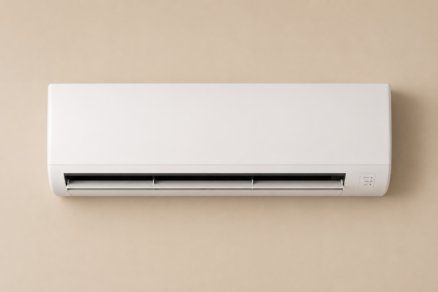 Wall-mounted white air conditioning unit on a beige wall