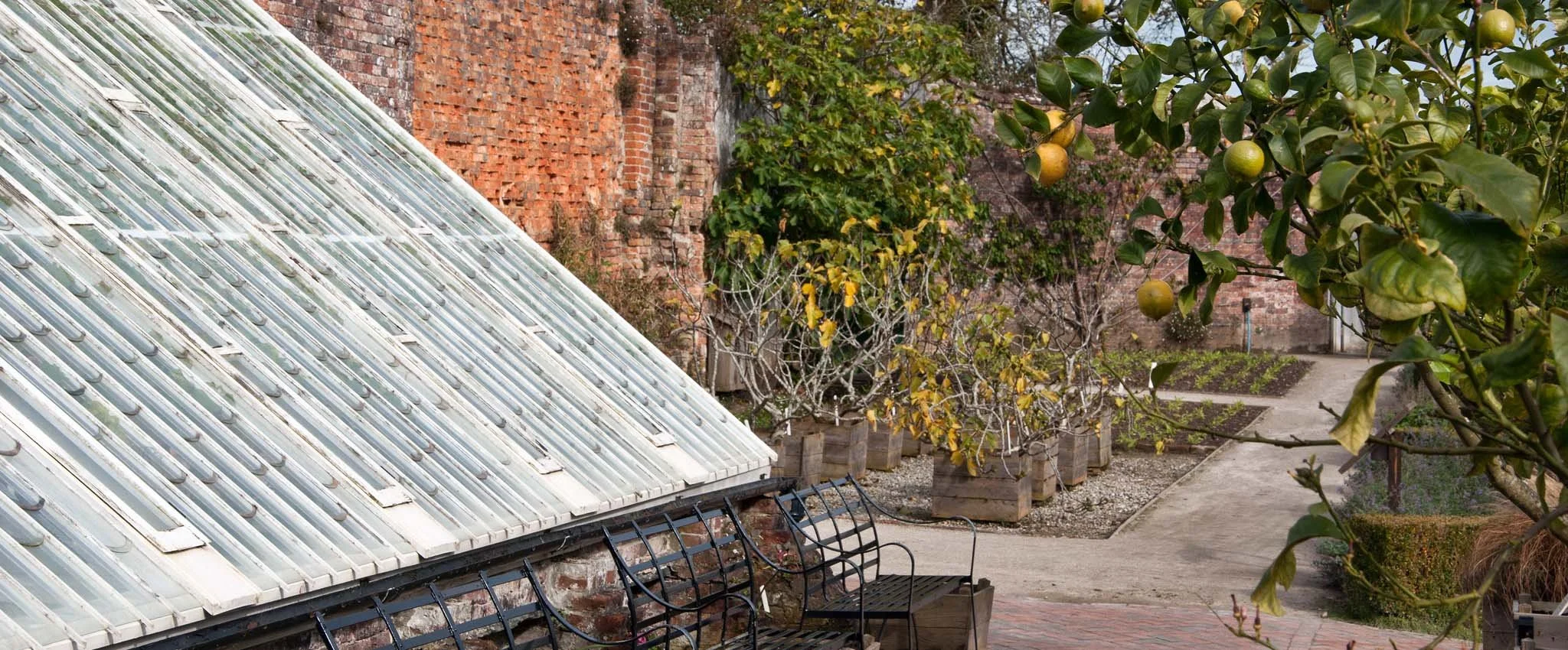View of the walled garden and glass houses at Heligan Gardens near Mevagissey.