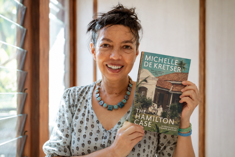 Michelle de Kretser with her book The Hamilton Case