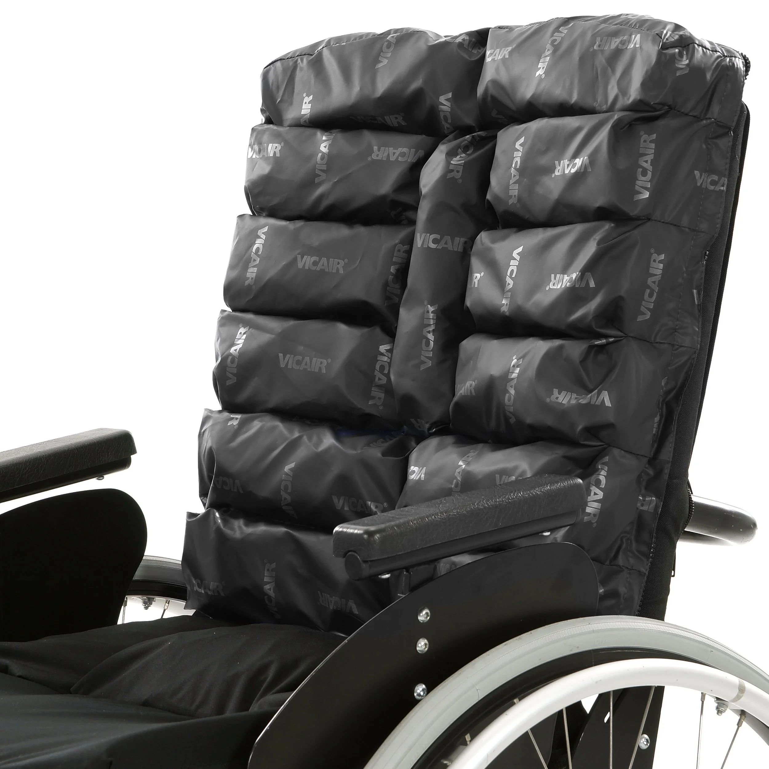 Wheelchair with a padded backrest filled with multiple foam cushions labeled VICAIR.