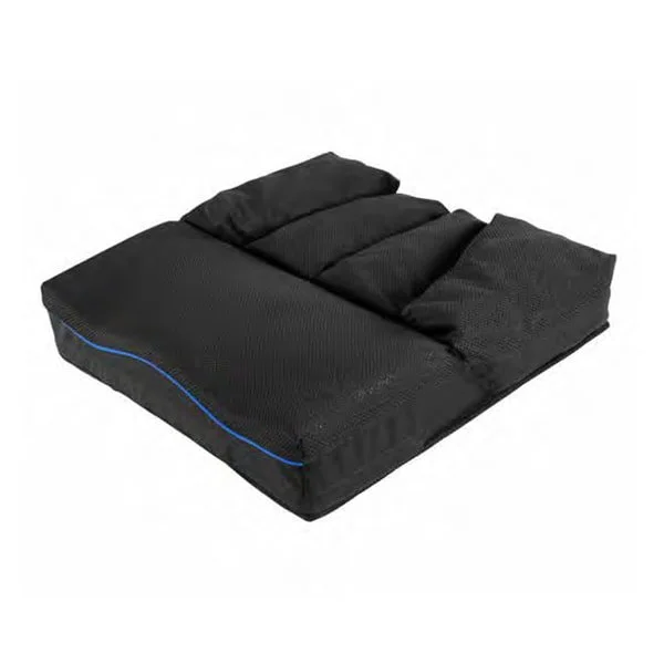 A black memory foam mattress topper with two pillows on top.