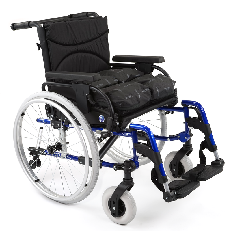 Black and blue wheelchair with large rear wheels, small front wheels, and a cushioned seat and backrest.