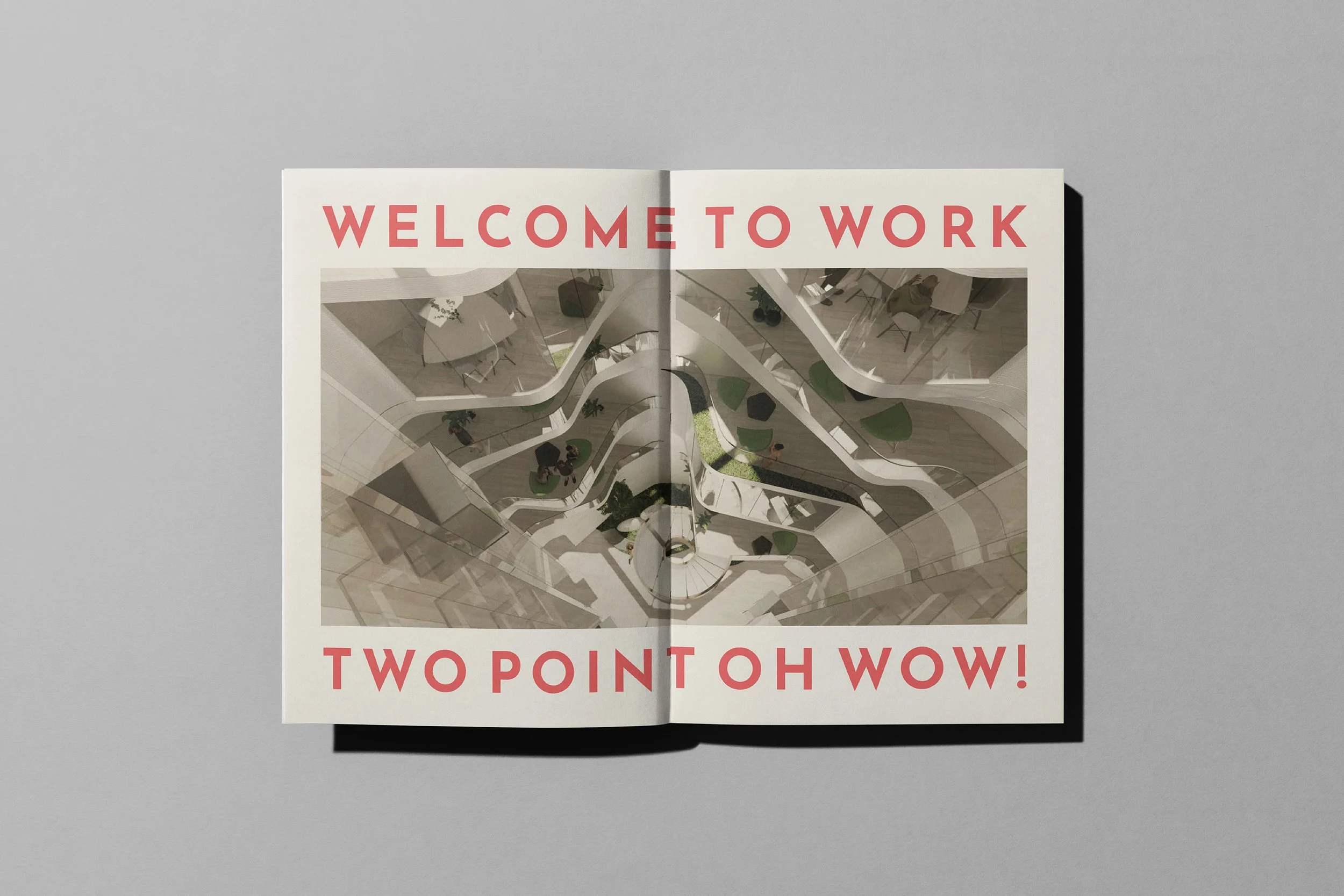 Open magazine pages showing a modern, multi-level office interior with the text 'Welcome to Work' at the top and 'Two Point Oh Wow!' at the bottom.