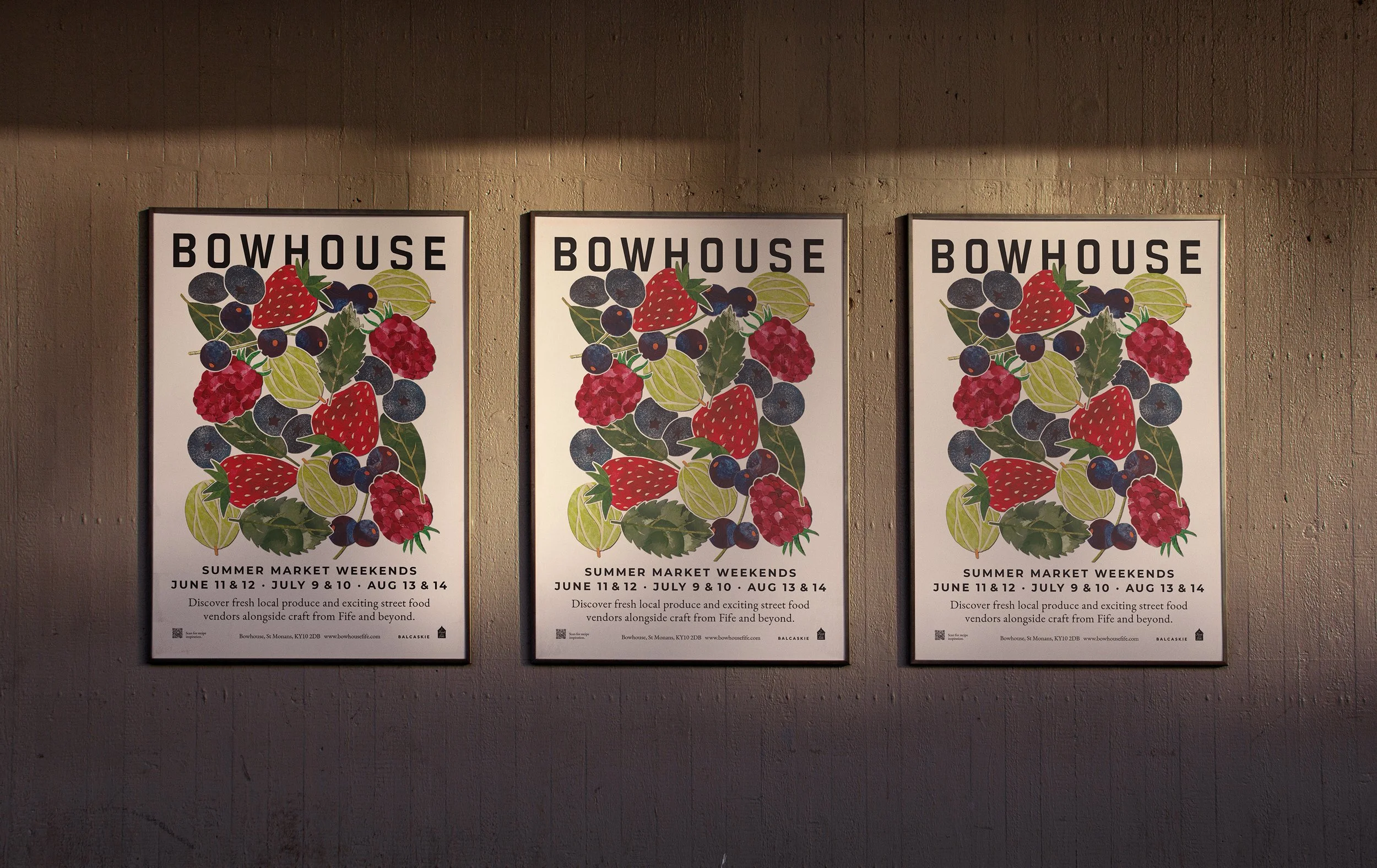 Three posters advertising Bowhouse summer market weekends with illustrations of strawberries, blueberries, raspberries, and leaves on a wall.