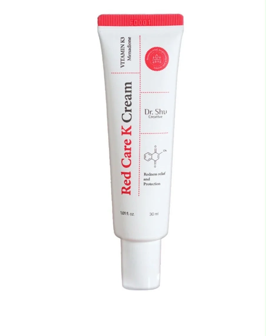 A white tube of Red Care K Cream with a red cap, featuring black and red text and a chemical structure diagram.