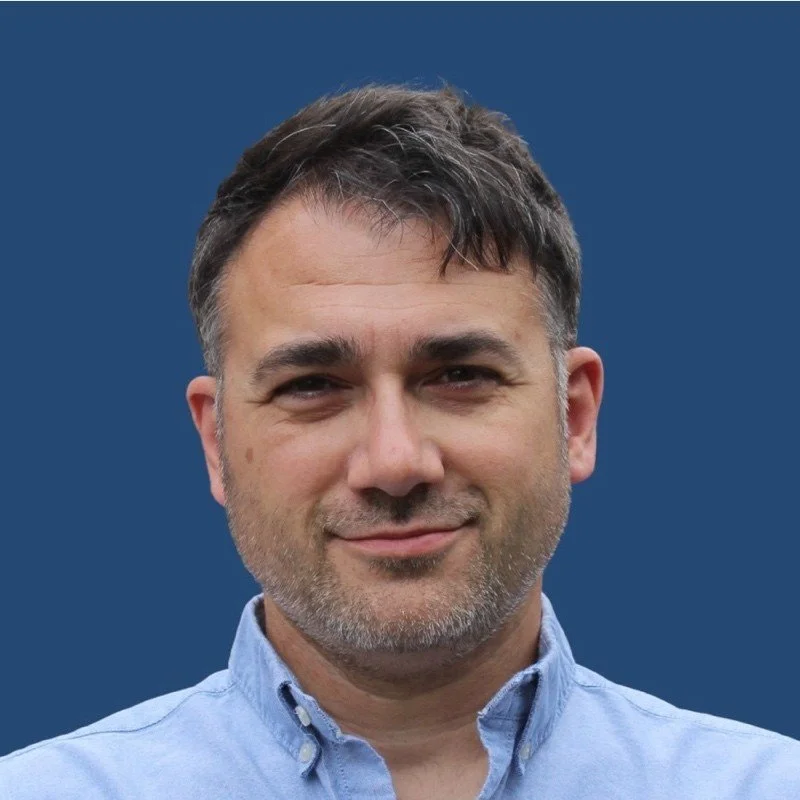 A headshot of our founder, Robin Hodges.