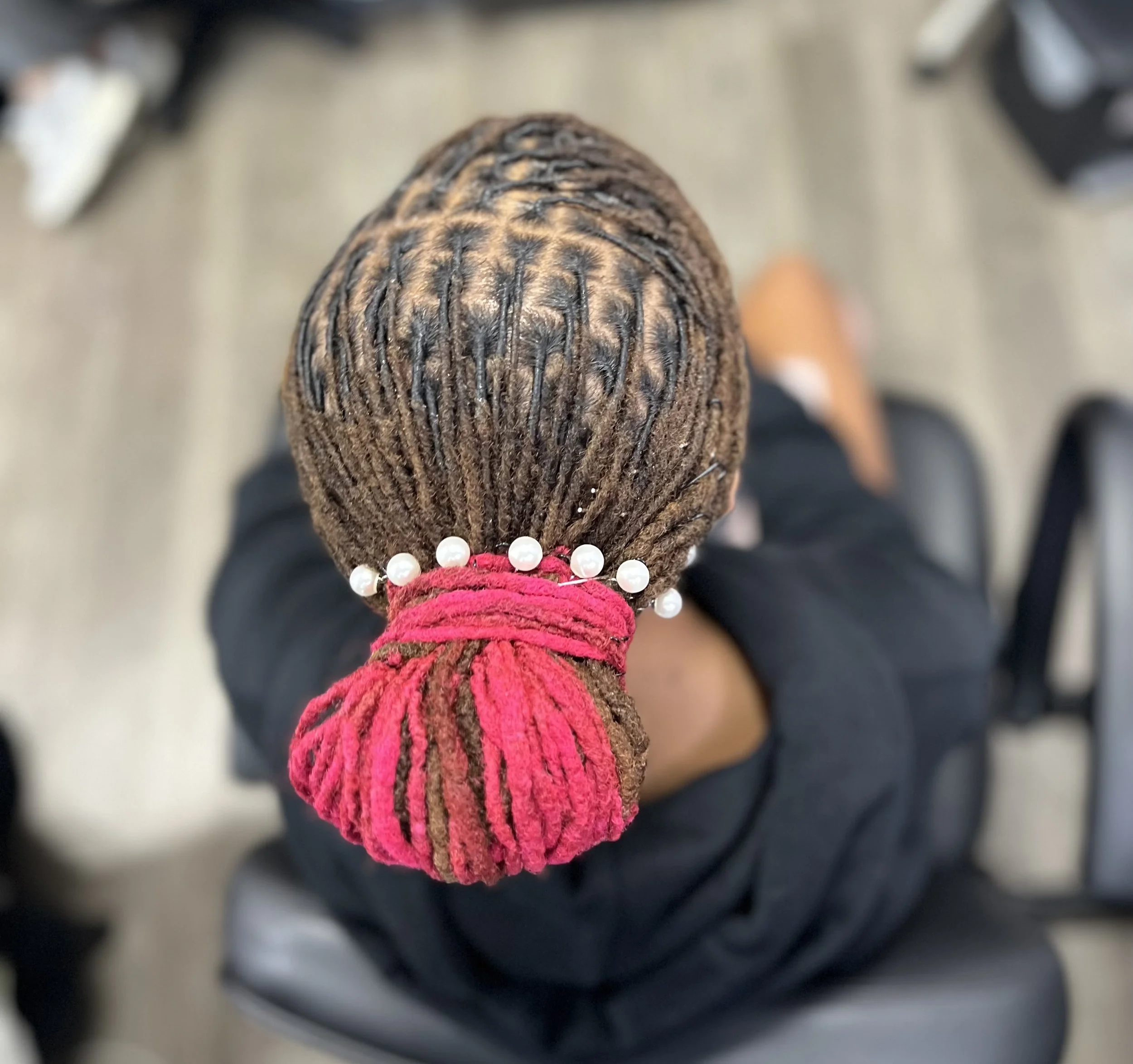 Salon customer with new long natural braids