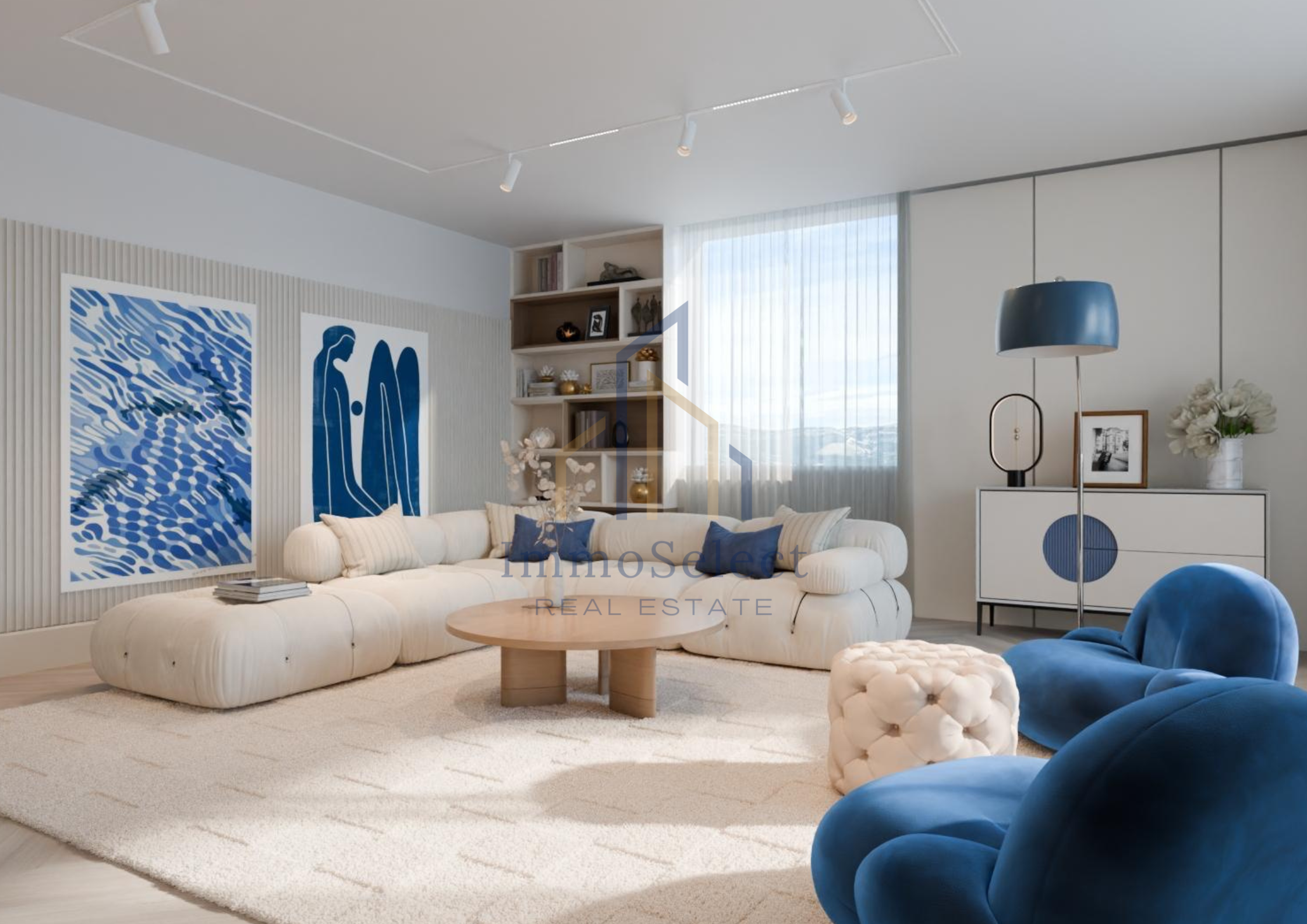 Modern living room with white sectional sofa, blue and white throw pillows, two blue velvet armchairs, a round wooden coffee table, cream ottoman, white shelving unit, framed artwork, and a large window with sheer curtains.