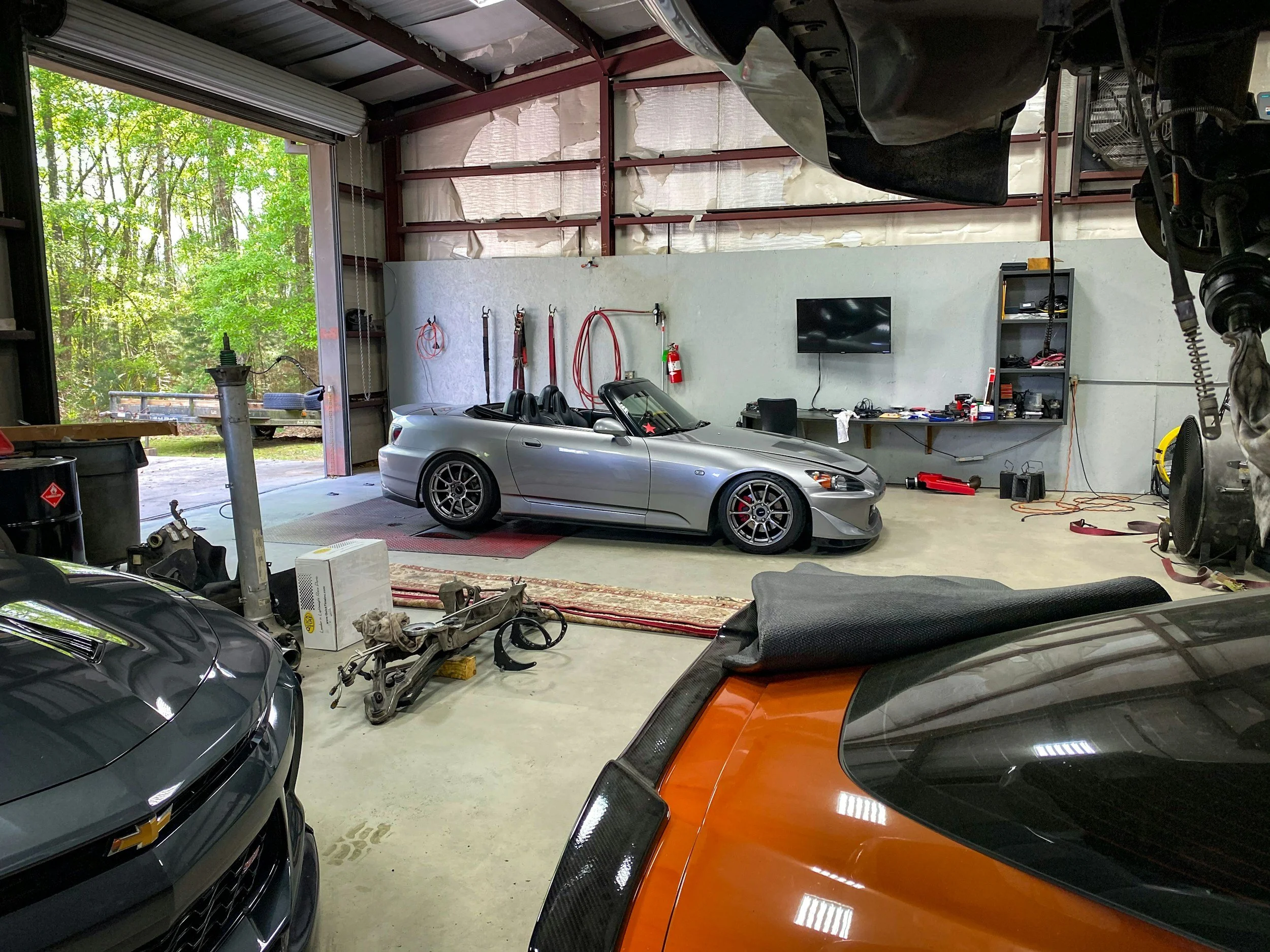 automotive repair garage with convertible car